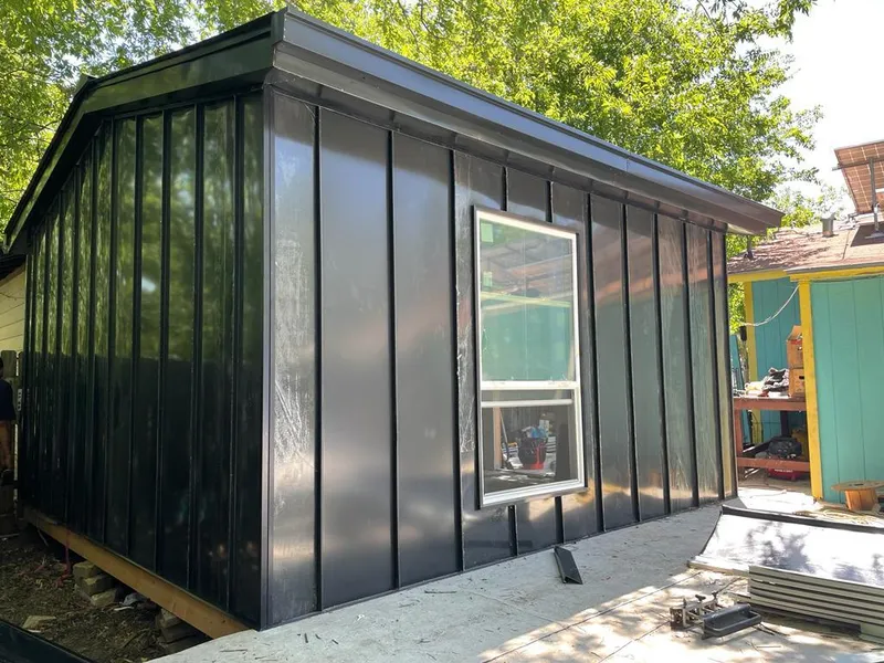 Black standing seam metal wall panels for Metal Roof Installation in Brunswick